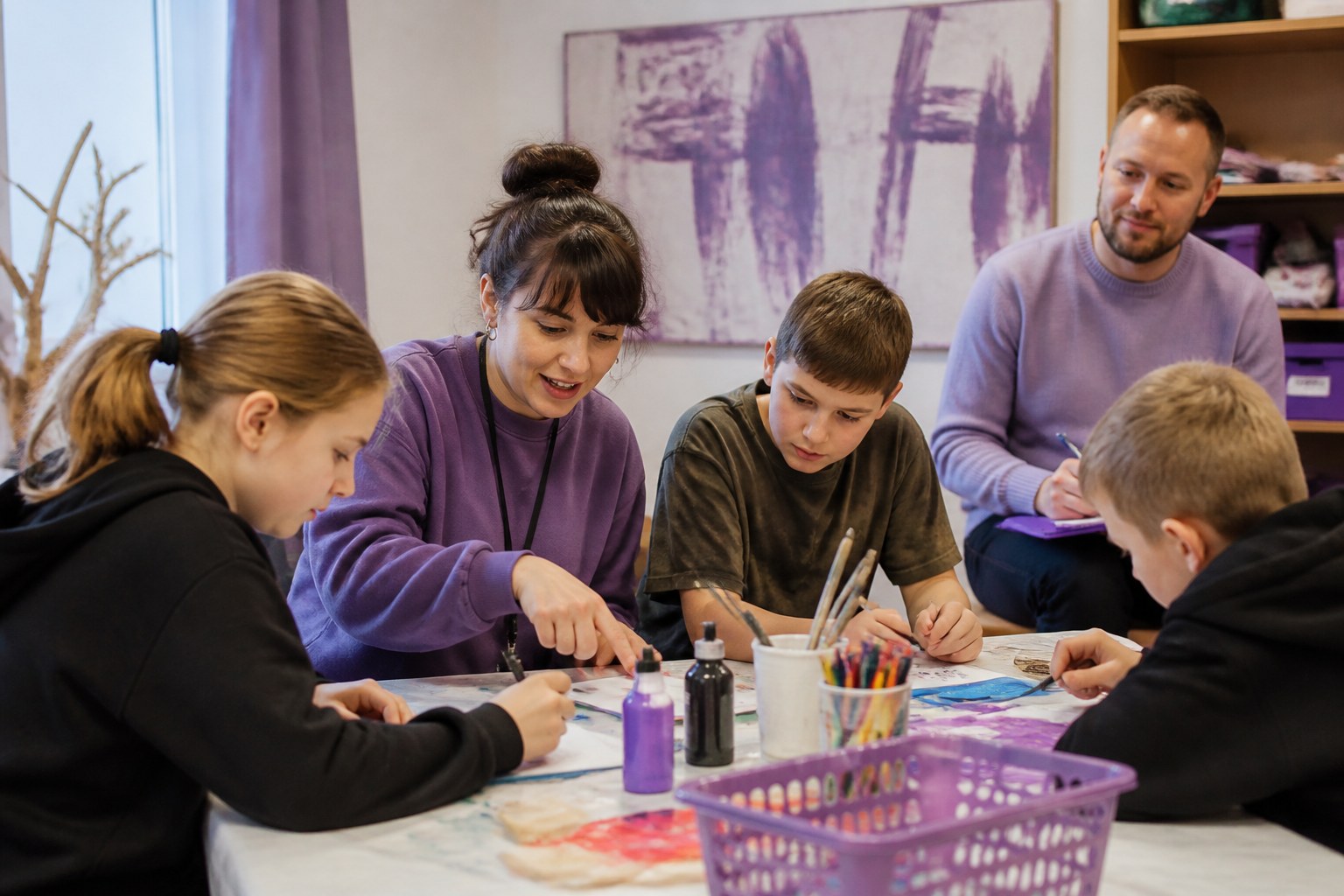 Social pedagogue leading a creative group activity with young people